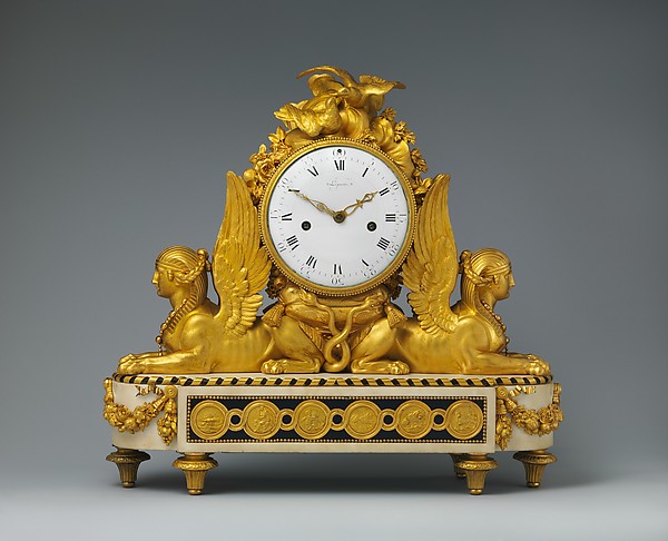 A pair of Régence giltwood fauteuils, upholstered in later Gobelins-style tapestry.